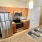 kitchen with wood cupboards and white walls