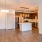 kitchen area on wooden floor with spacious counter-space and designer appliances