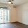 living room with large open spaces and excellent lighting from large window/patio doors